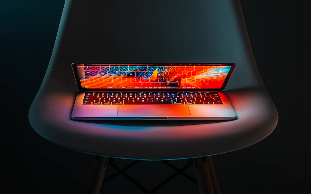 Laptop glowing in the dark representing modern web development