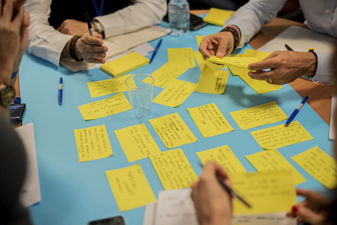 Team mapping user journeys with sticky notes