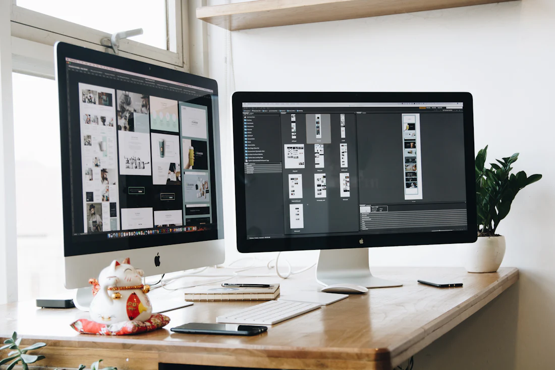 UX design workspace with website mockups on a desktop screen